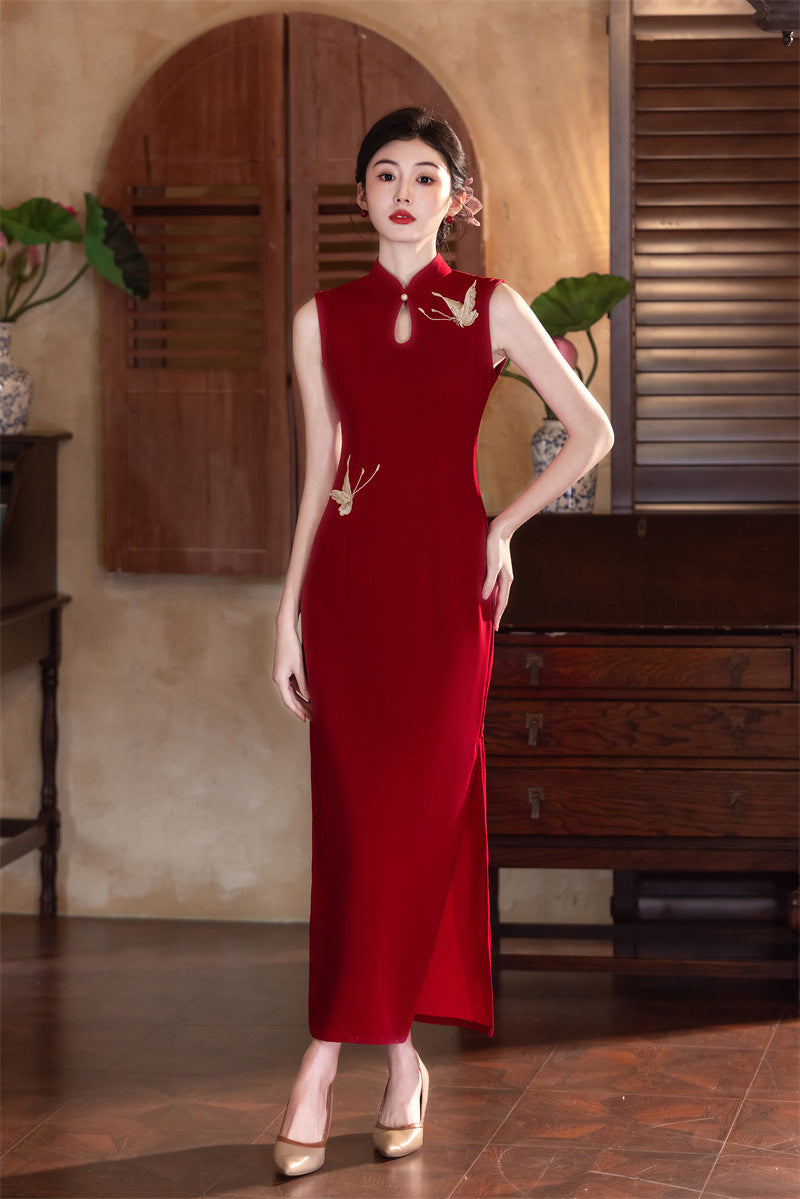 Full-length wine red wedding qipao with a high side slit