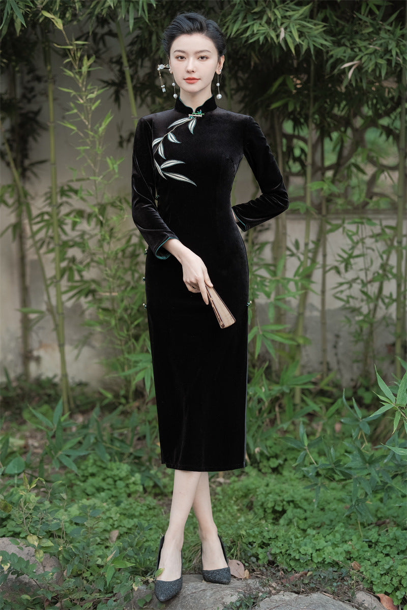Full-length view of the black velvet bamboo embroidered qipao