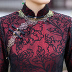 Mandarin collar and gold piped trim on the wine red cheongsam