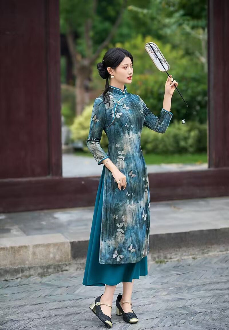 Side view of the teal velvet butterfly print qipao dress
