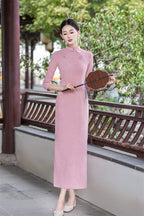 Pink long qipao dress with elbow-length sleeves, side view