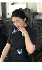 Close view of the embroidered butterflies and short sleeves