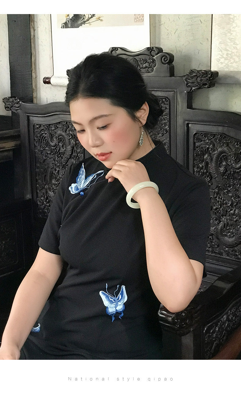 Close view of the embroidered butterflies and short sleeves