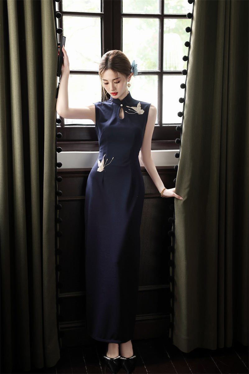 Three-quarter view of the navy crane embroidered cheongsam