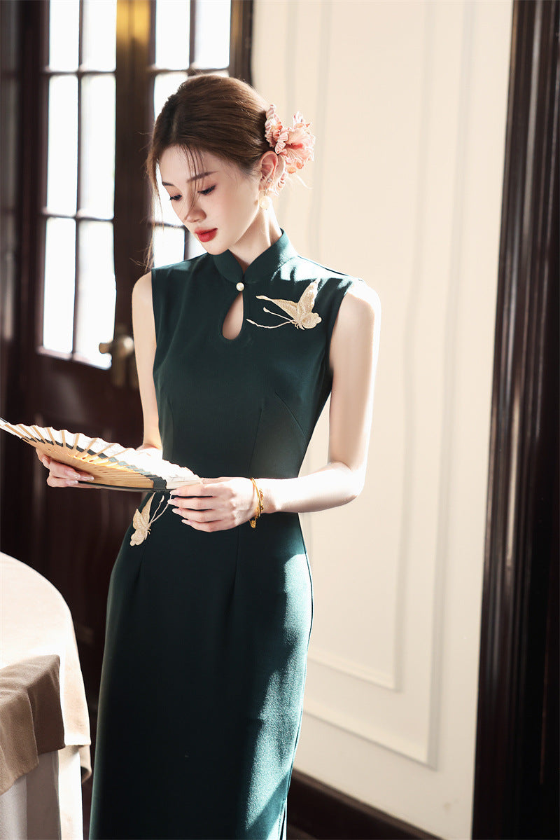 Deep green crane embroidered qipao dress, front view