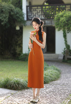 Rust orange crane embroidered cheongsam outdoors