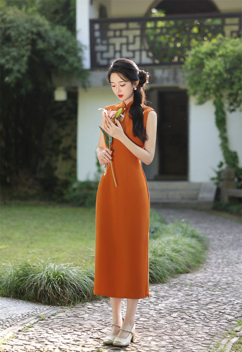 Rust orange crane embroidered cheongsam outdoors