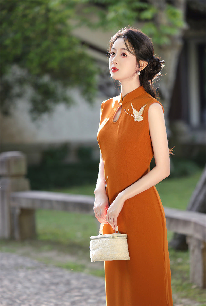 Rust orange crane qipao worn walking