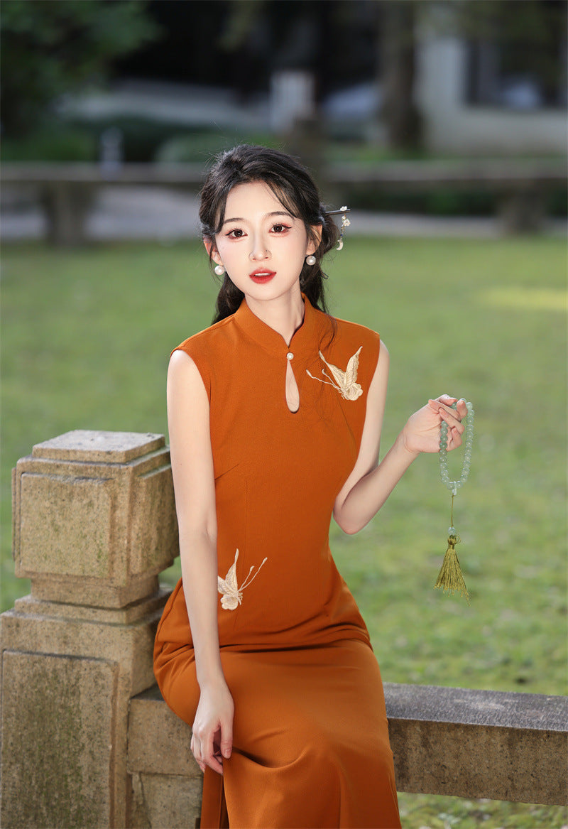 Rust orange crane qipao seated