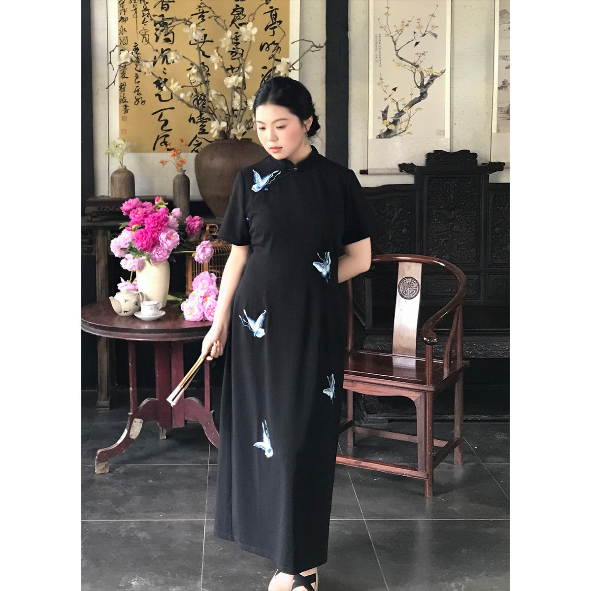 Plus size black qipao dress with blue embroidered butterflies, front view