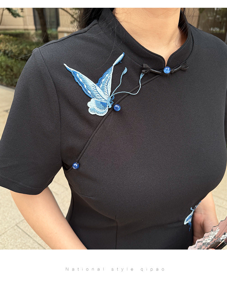 Mandarin collar, frog buttons and embroidered butterfly on the black qipao