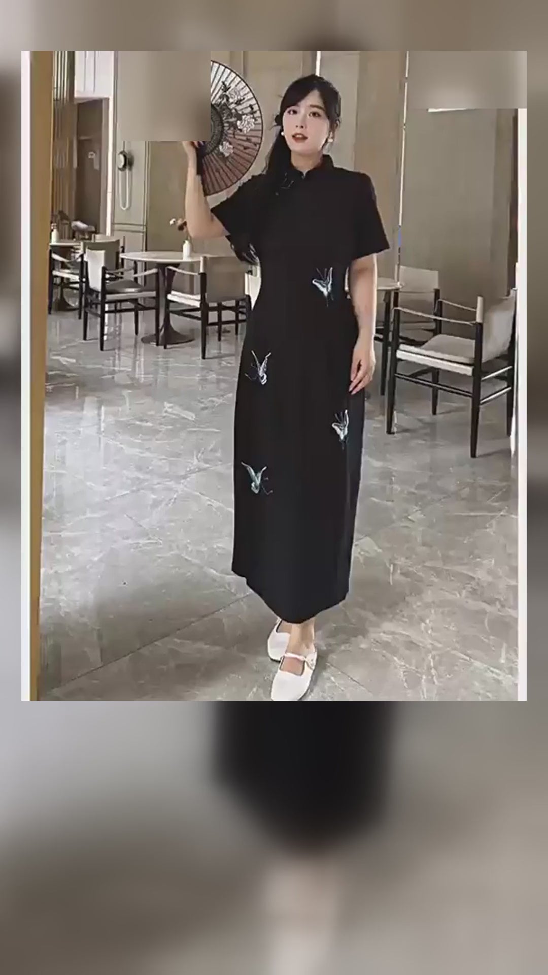 Plus size black butterfly embroidered qipao dress on a model, front and back